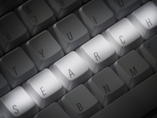 tastiera di un pc con scritto search.